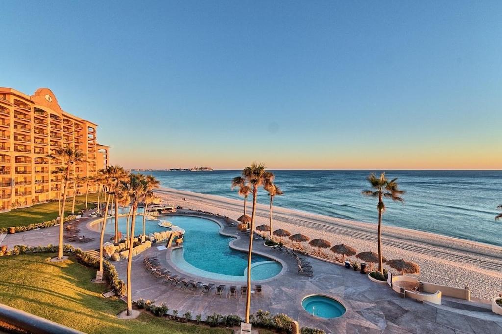Beachfront resort and pool at sunset in Rocky Point, MX